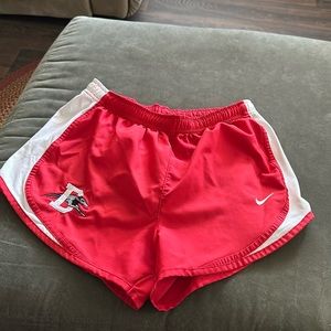 Women’s red, Nike running shorts